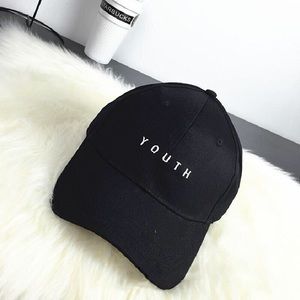 Black cap with ‘YOUTH’ on front.